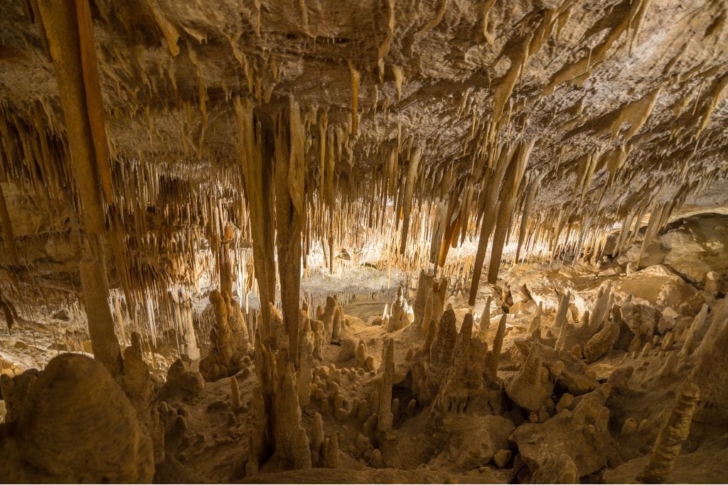 A photo of the Caves of Drach in Mallorca with stalactites and stalagmites