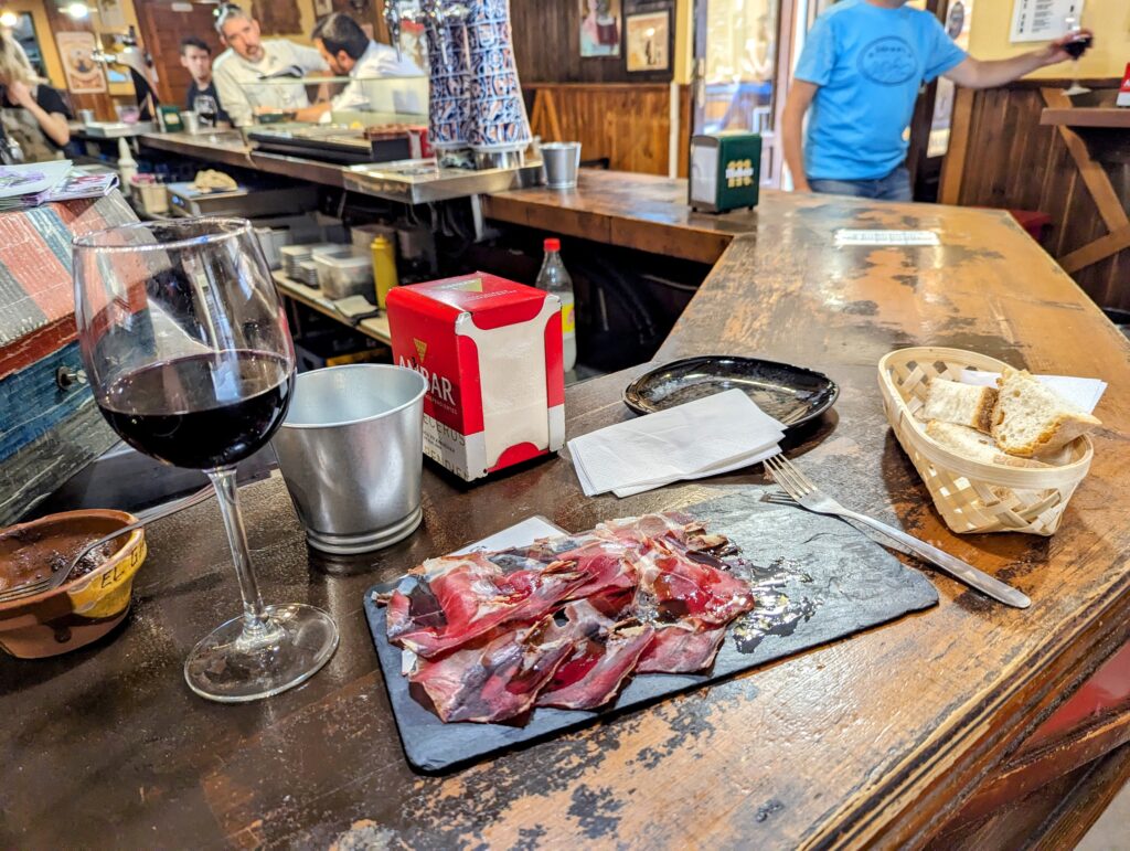 A photo of tapas and wine in a bar in the city of Leon in Spain.