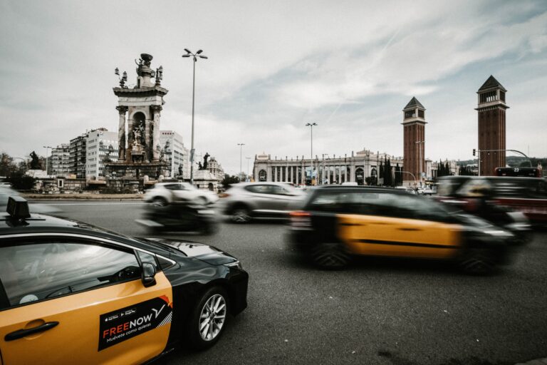 Taxis and Ubers in Barcelona driving near the Plaça d'Espanya