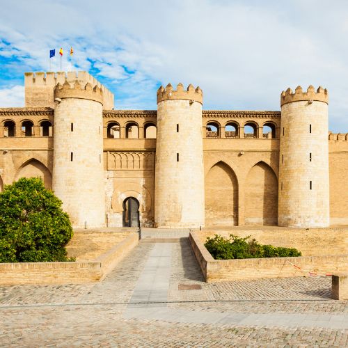 The majestic Aljafería Castle in Zaragoza, Spain, featuring its unique architectural style and rich history.