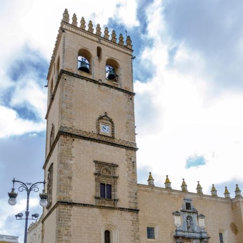 A square stone tower on the cathedral in Badajoz, Spain