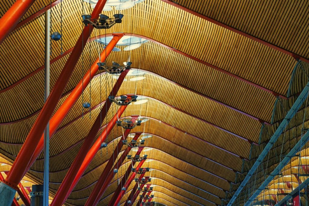 A substantial building with an array of red and orange poles, creating a striking visual impact.