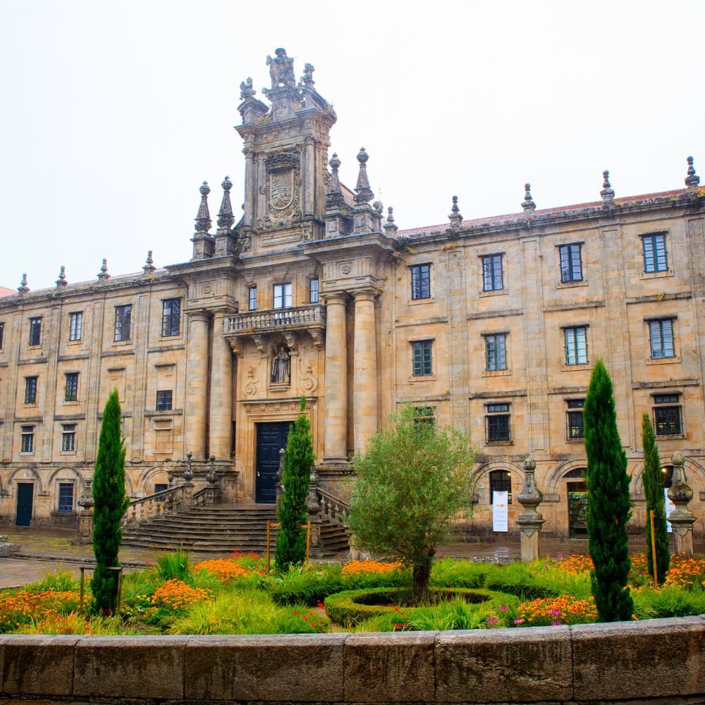 A large building with numerous windows located in Santiago de Compostela, Spain.