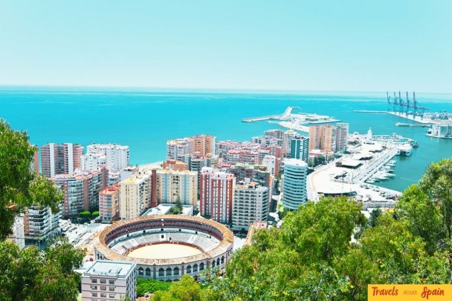 The historic bullring of Málaga with the sparkling Mediterranean Sea in the background, a must-see landmark and one of the best places to visit in Spain for first-time travelers.