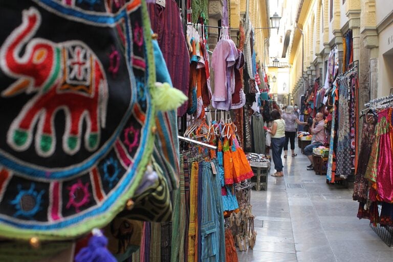 View of the Alcaicería in Centro, Granada, with traditional market stalls in the background selling colorful goods — a vibrant spot to explore when choosing where to stay in Granada, Spain.
