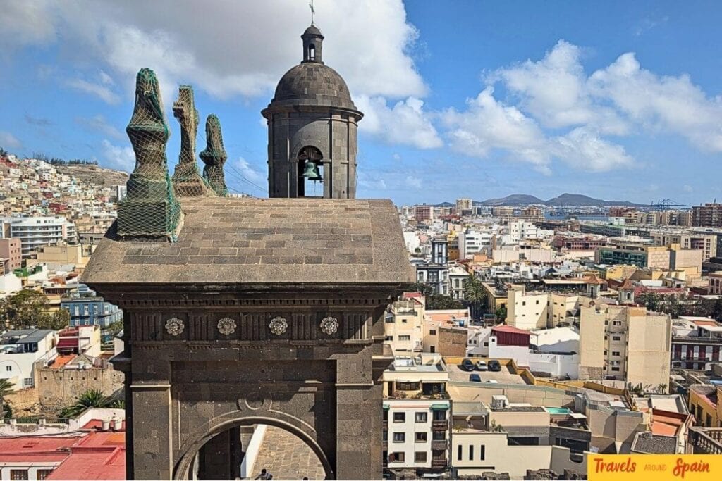 Las Palmas Cathedral and cityscape from elevated viewpoint in Gran Canaria showing urban culture meets historic architecture with perfect weather.