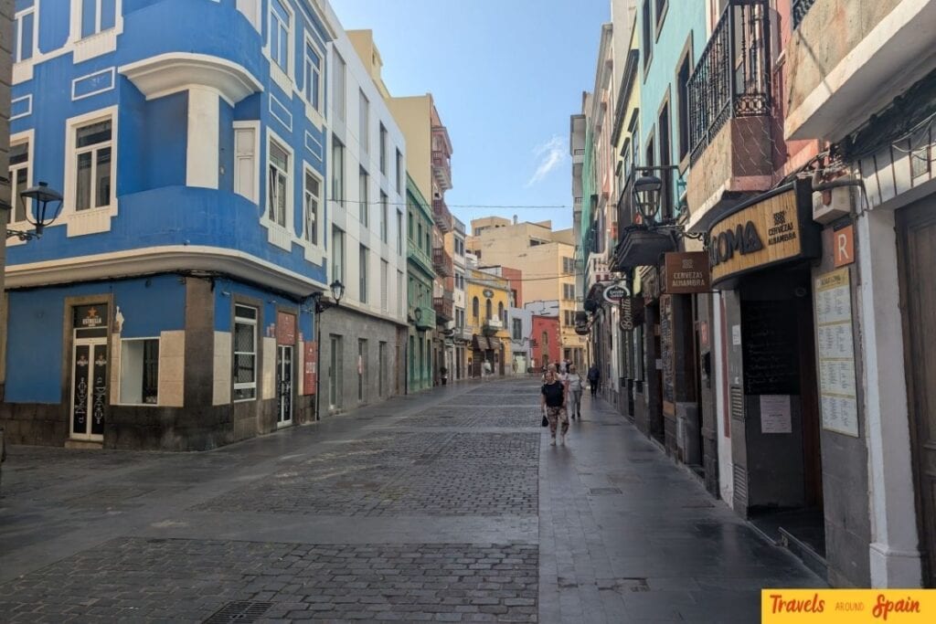 Colourful colonial buildings with traditional Canarian architecture lining a cobblestone street in Las Palmas historic Vegueta district