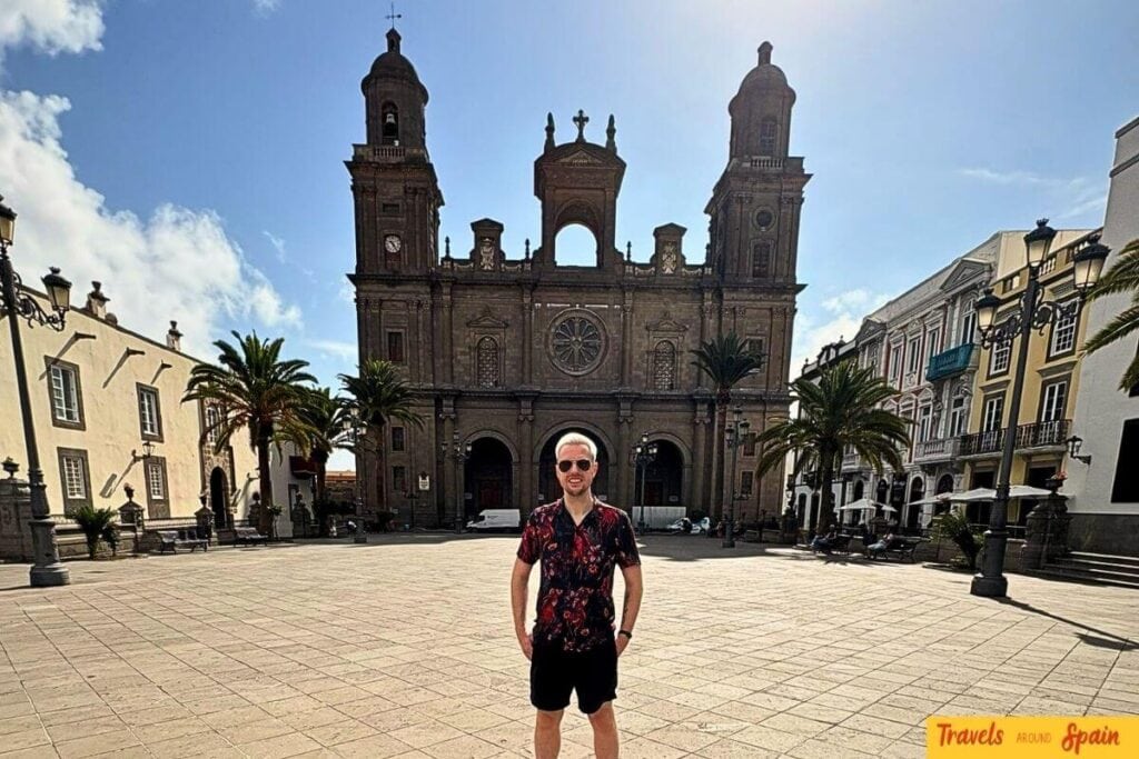 Las Palmas Cathedral plaza in Gran Canaria showing perfect weather conditions for cultural sightseeing and historic exploration year-round.