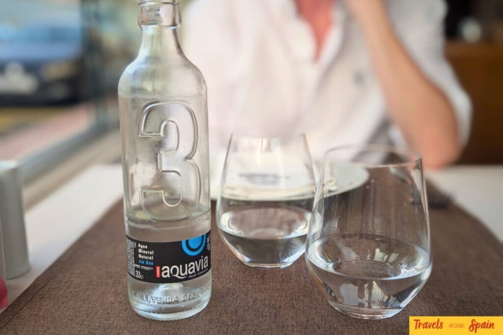 Local Gran Canaria water brand served in restaurant showing typical local dining preferences