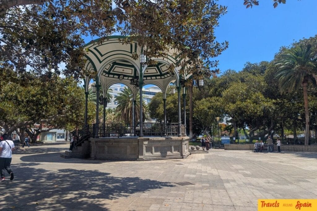 Historic bandstand in Parque de San Telmo, Las Palmas, with ornate green metalwork and palm trees in background