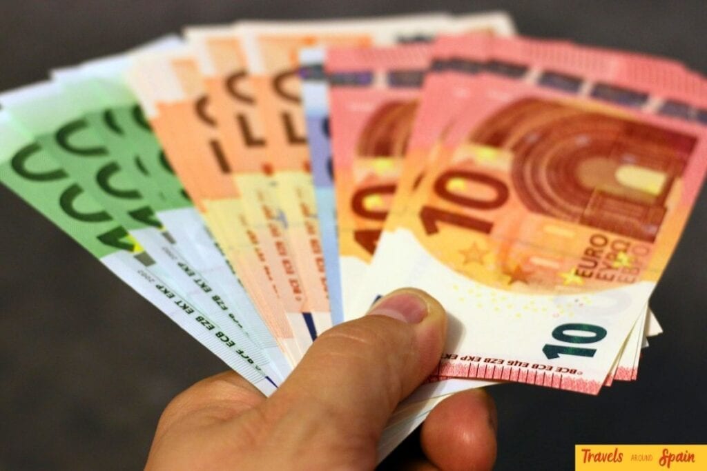 Hand holding euro notes for Gran Canaria daily spending and cash payments