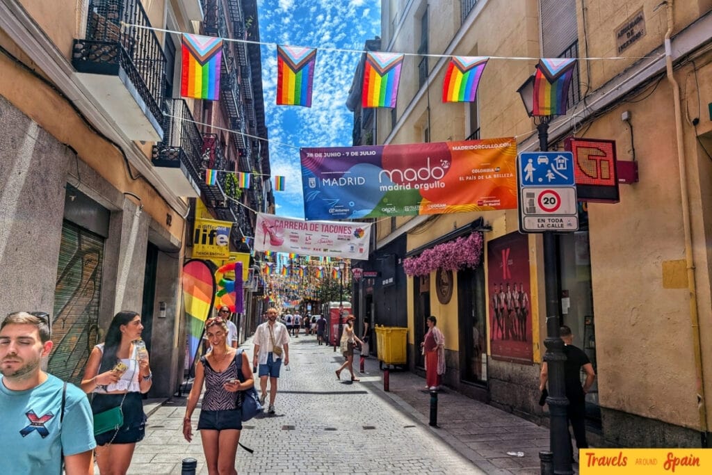Madrid Pride MADO banners and rainbow flags decorating Chueca streets during gay pride celebrations