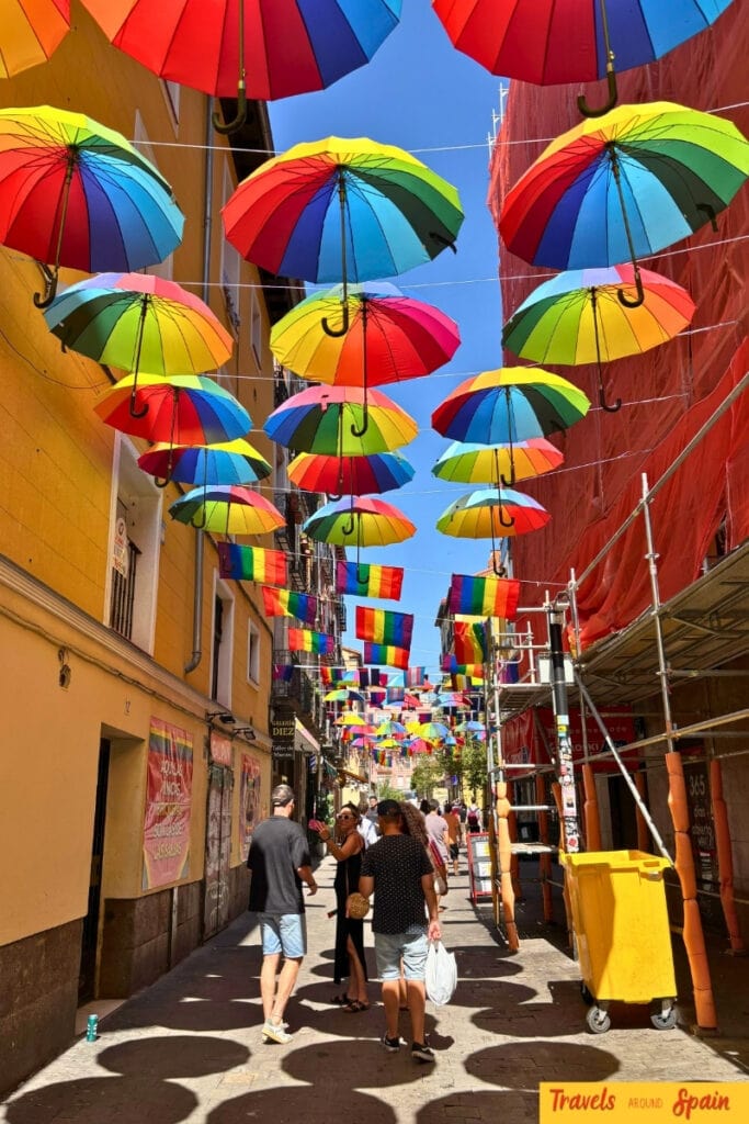 Colourful rainbow umbrellas art installation in Madrid Chueca district during Pride celebrations