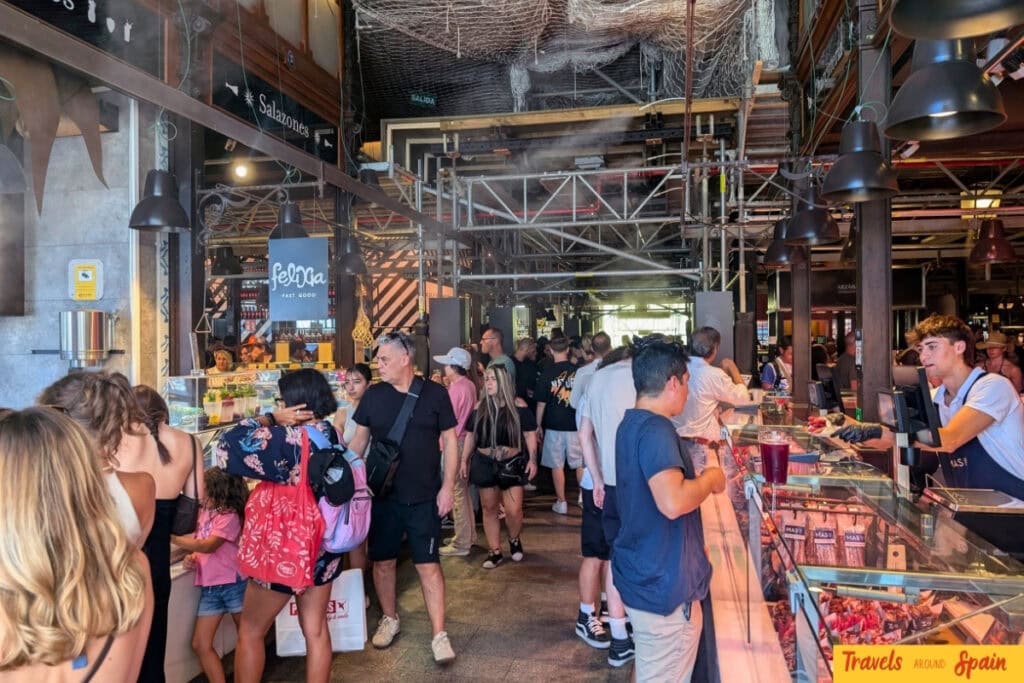 Mercado de San Miguel Madrid interior showing Spanish tapas stalls.