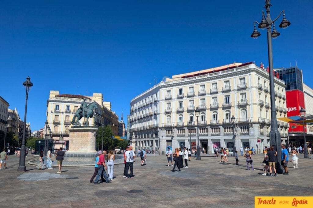 Puerta del Sol Madrid central square with tourists and historic buildings