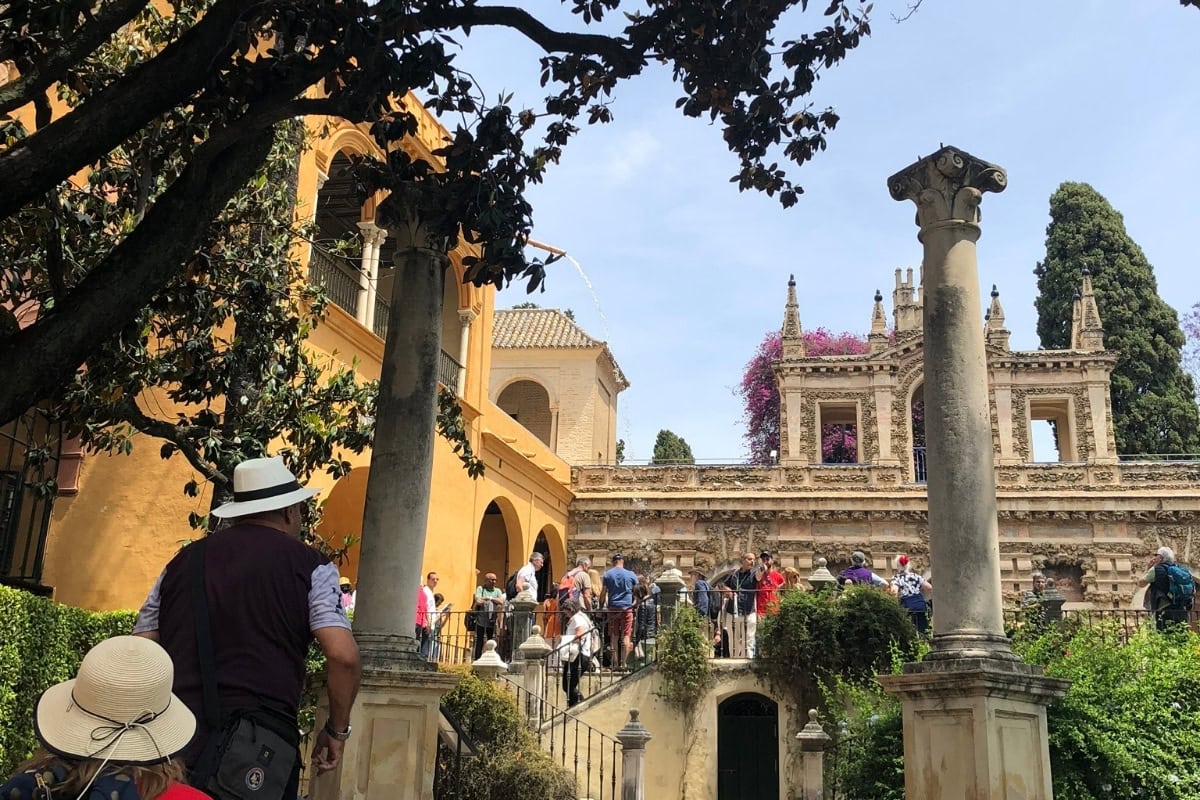 Real Alcázar Seville with crowds enjoying the magnificent gardens