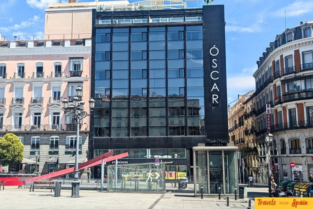 Room Mate Oscar hotel building in Madrid Chueca neighborhood with modern glass facade