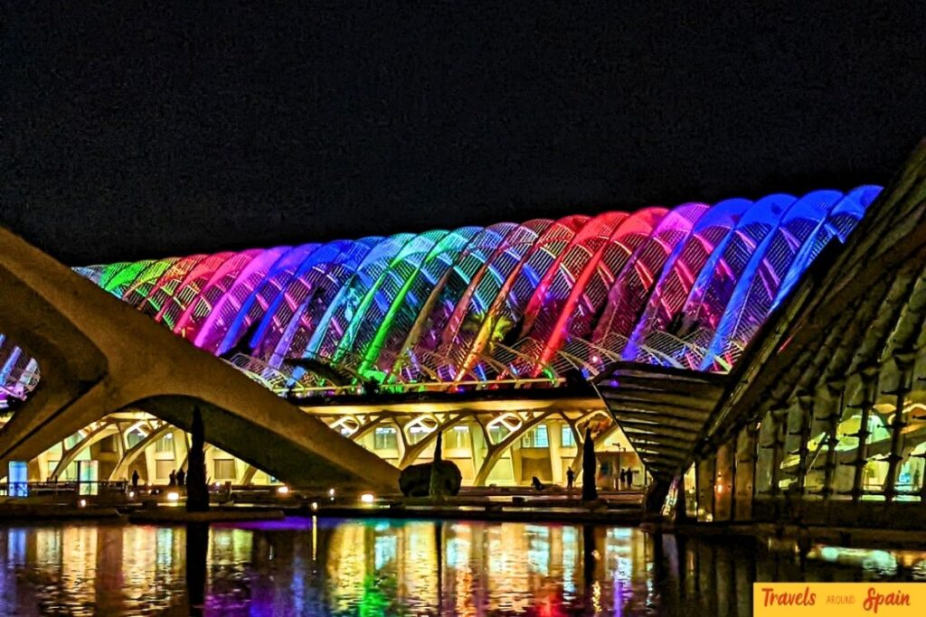 Bridge in Valencia illuminated with rainbow colors at night reflecting LGBT Pride support