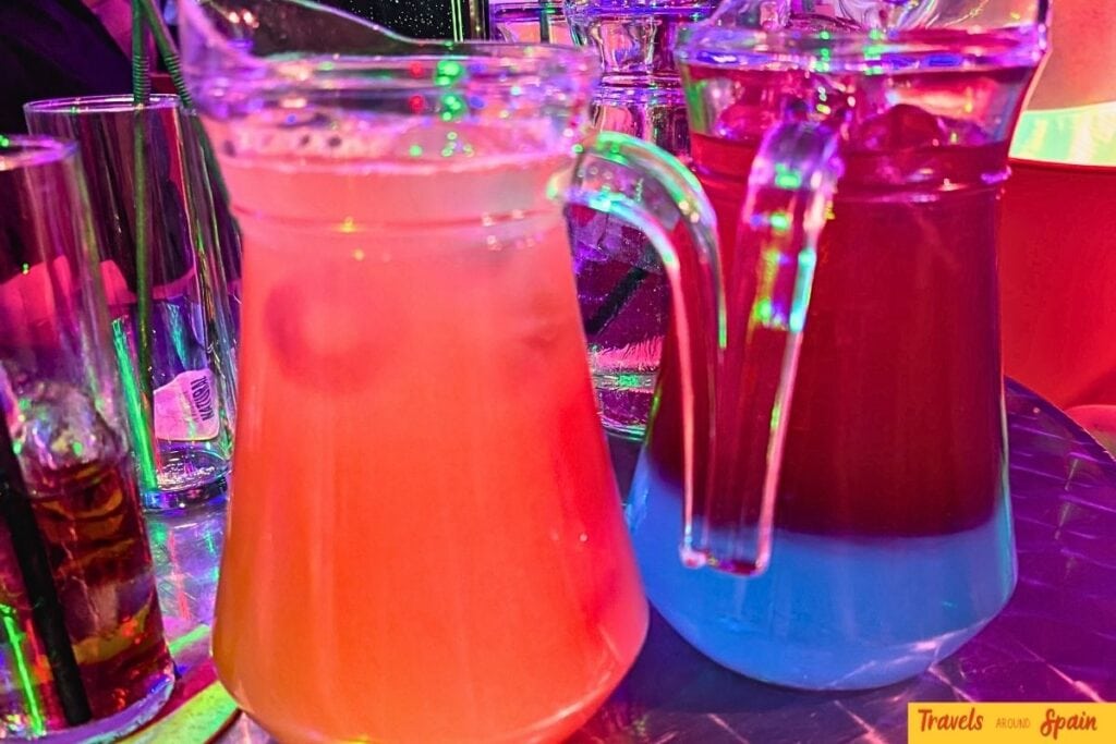 Cocktail pitchers at Sparkles Bar Maspalomas costing €13 during happy hour representing exceptional value for money.