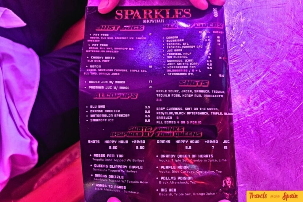 Sparkles Bar Maspalomas special offers and merchandise menu including t-shirts and drag show memorabilia.