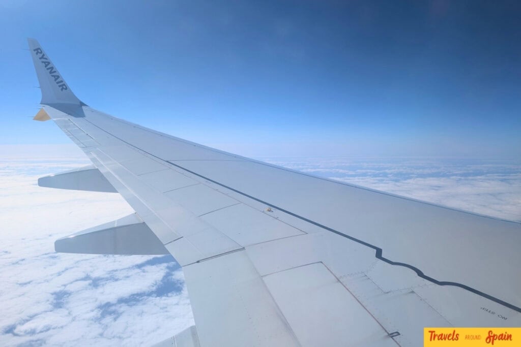 Ryanair aircraft wing during Valencia to Ibiza flight showing budget airline option with flights from €11