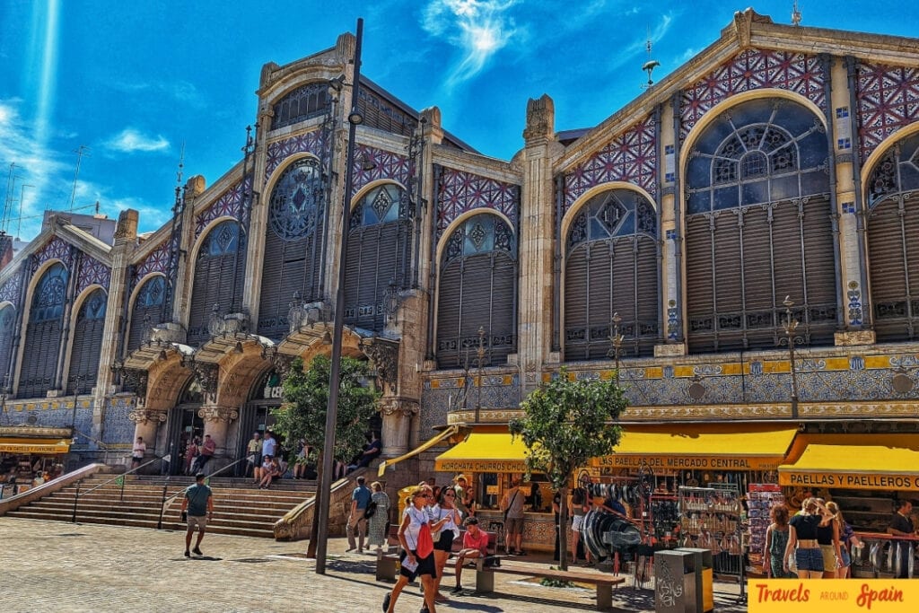 Magnificent Art Nouveau facade of Valencia's Central Market with ornate ironwork, coloured tiles and distinctive dome architecture
