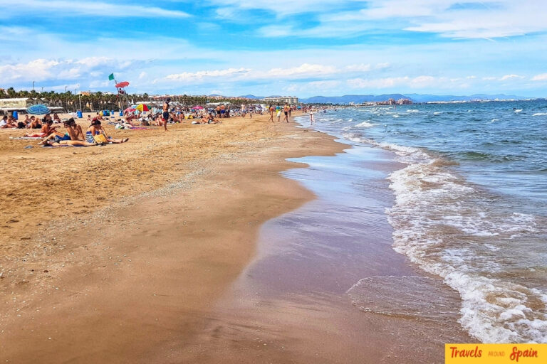 Malvarrosa Beach Valencia with Mediterranean waters and beachgoers, closest coastal beach to Madrid.