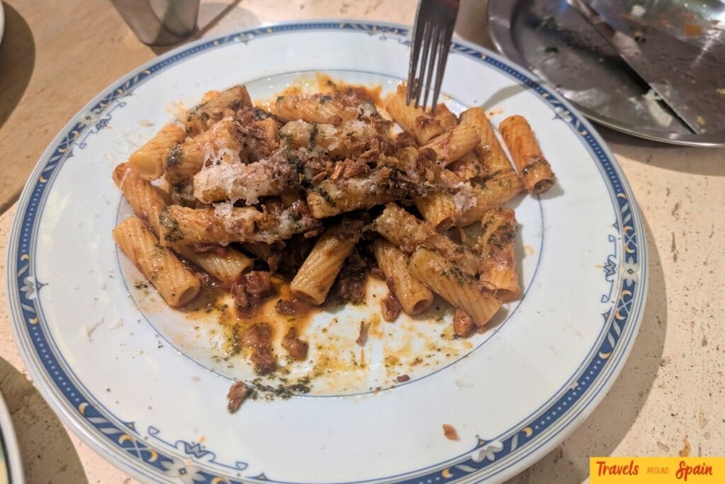 Beef shin ragu pasta topped with parmesan at Bodega Charlie’s in Sitges.