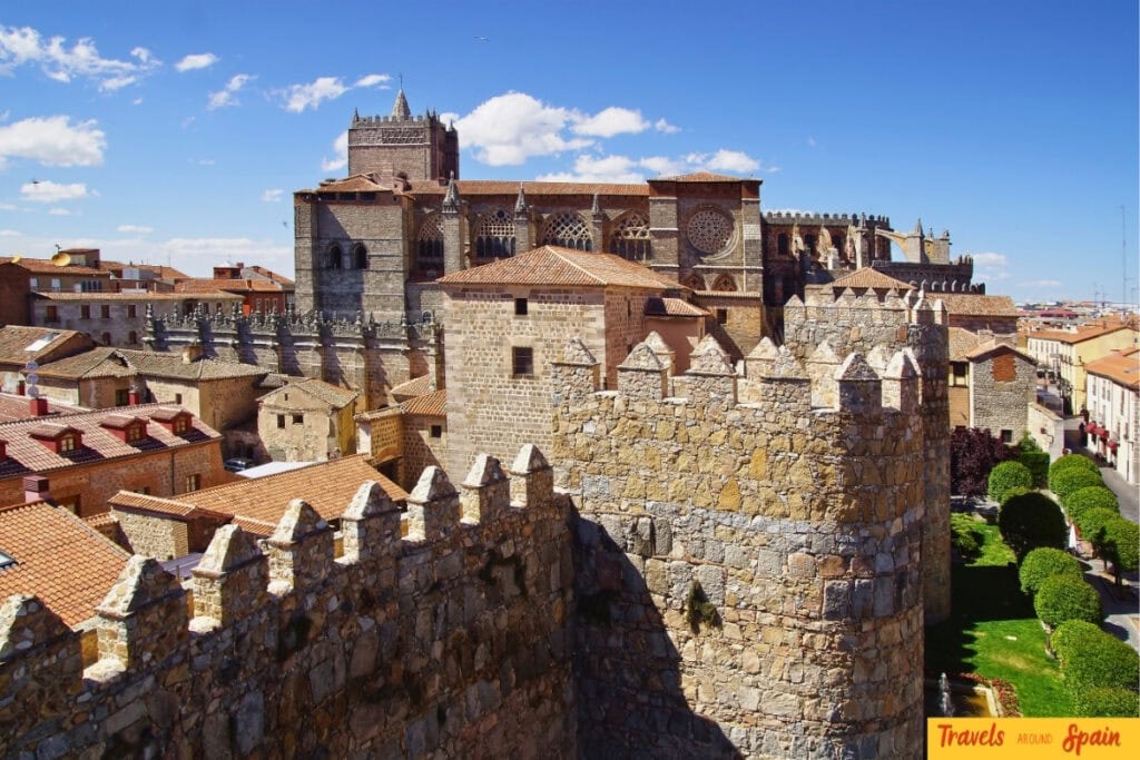 Ávila city walls glowing in autumn sunshine.