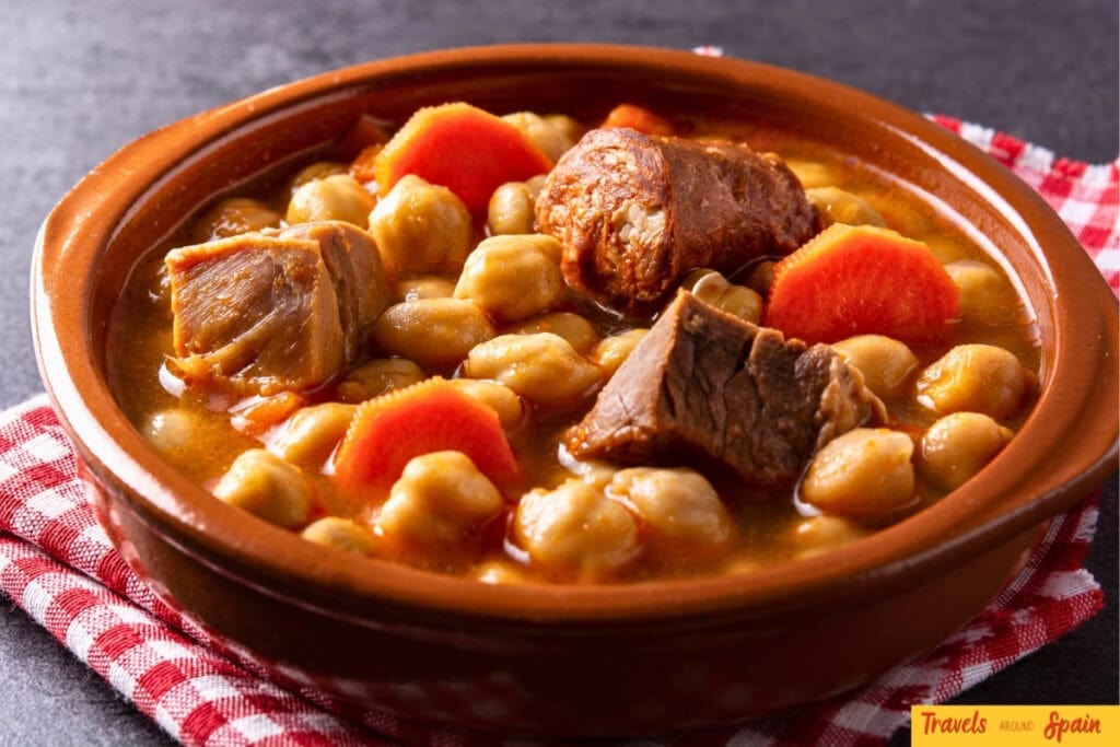Traditional cocido madrileño stew served in autumn.