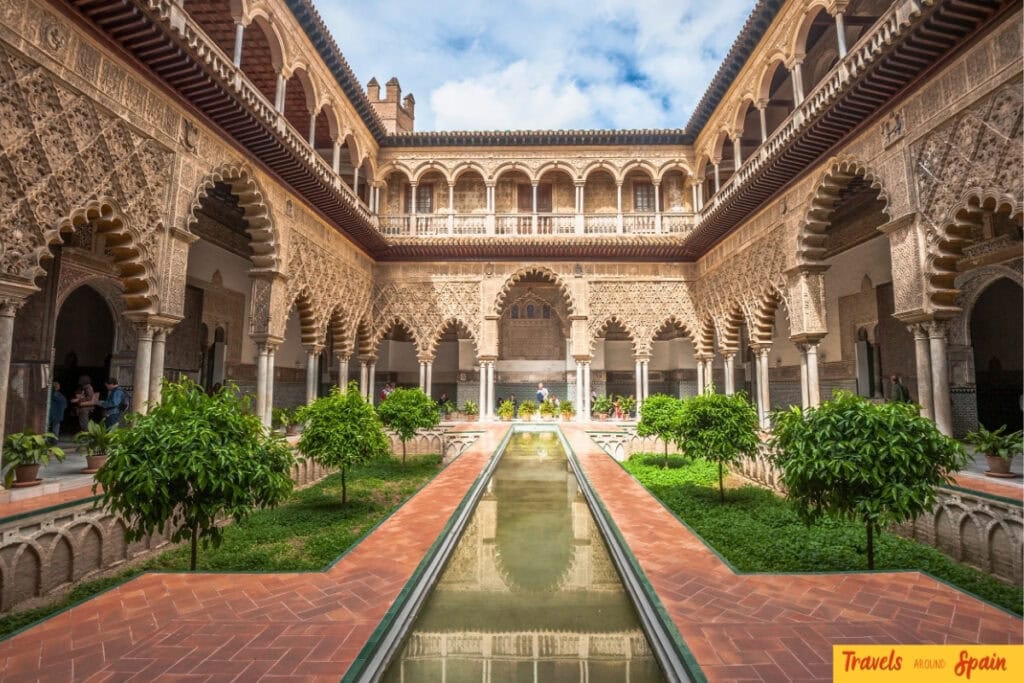 Royal Alcázar courtyard with autumn light in Seville.