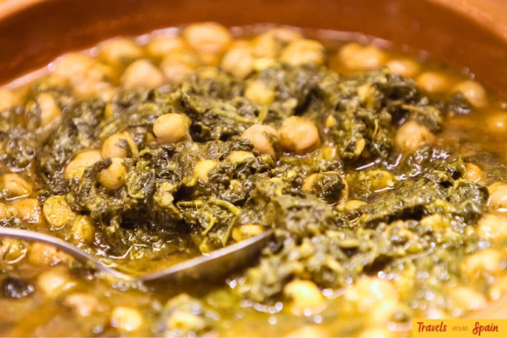 Traditional Andalusian dish espinacas con garbanzos served in Seville.