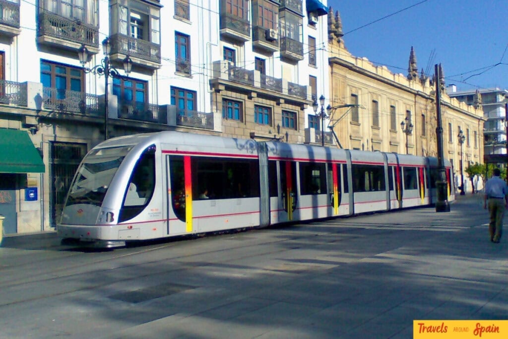 Modern tram in central Seville, an easy way to travel in October.