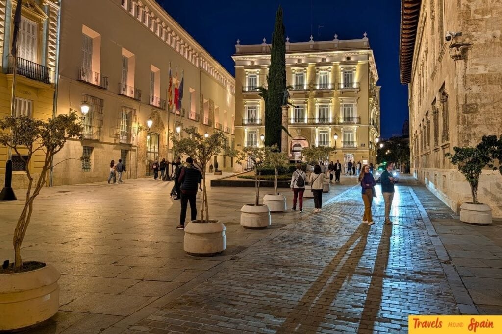 Evening street scene in Valencia with lights and mild November weather.