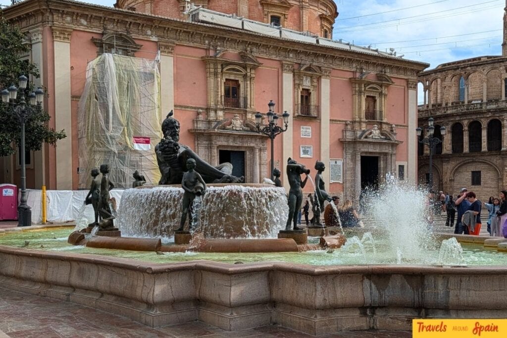 Plaza de la Virgen in Valencia on a sunny November morning with the fountain and cathedral.