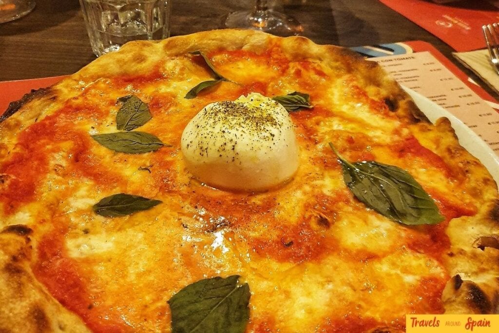 Freshly baked pizza served at a restaurant in Valencia