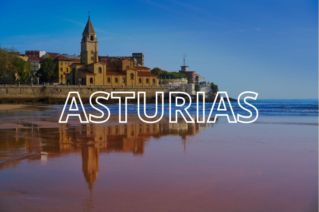 The beach in Gijon with the word Asturias overlaid in white writing.
