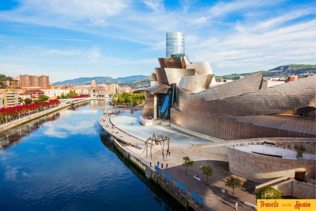 Guggenheim Museum in Bilbao along the river on a bright June day.