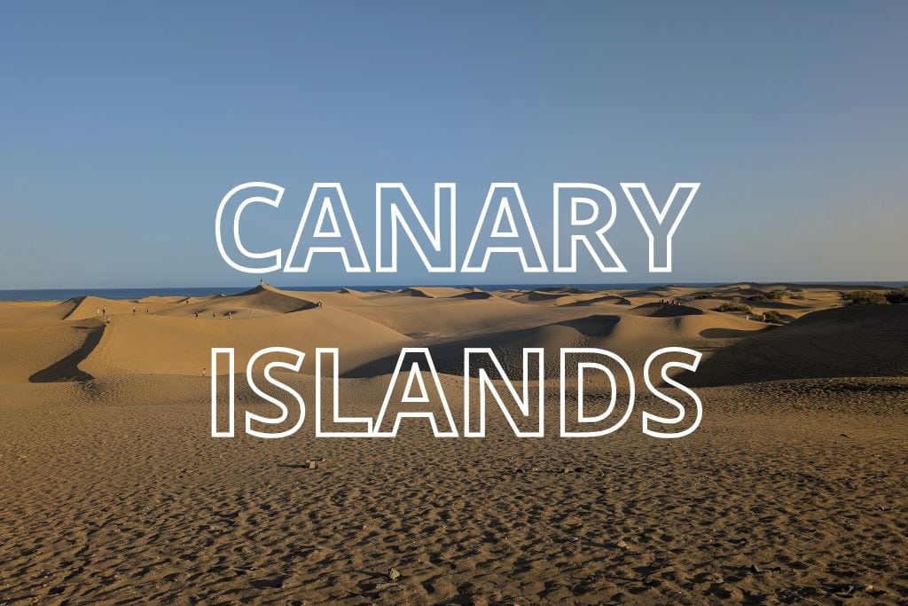 The dunes in Maspalomas in Gran Canaria with the words Canary Islands overlaid in white writing.