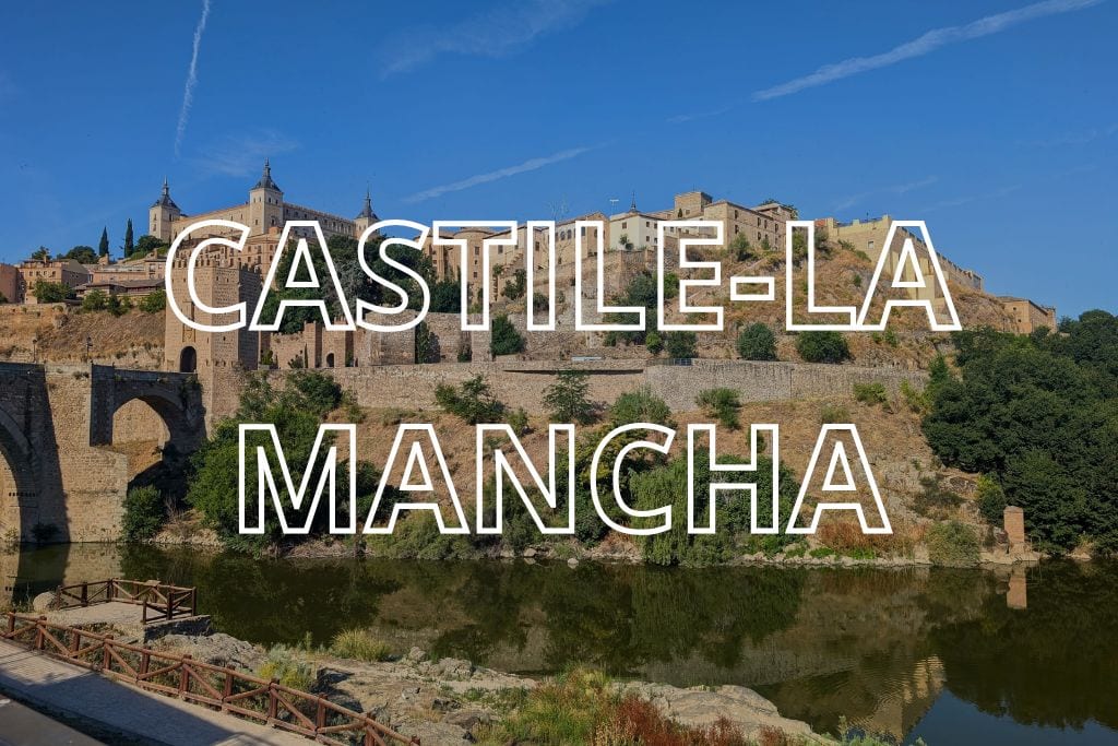 A view of Toledo with the words Castile-La Mancha overlaid in white writing.