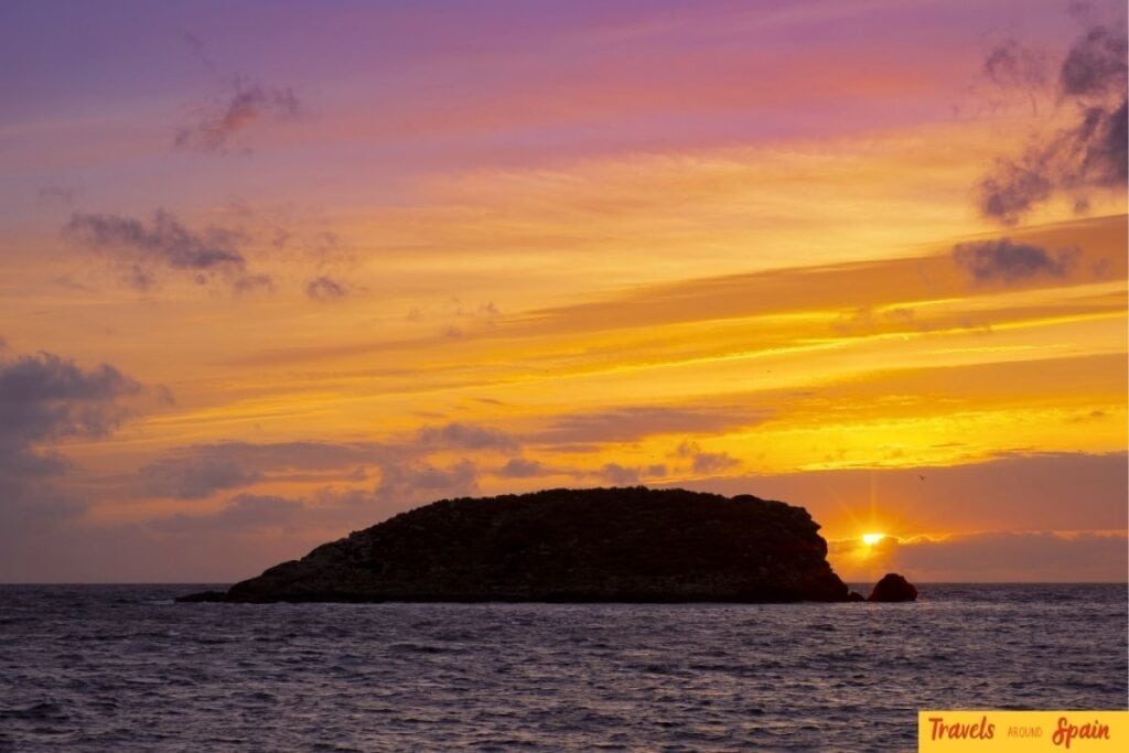 Sunset over the sea in Es Canar, Ibiza