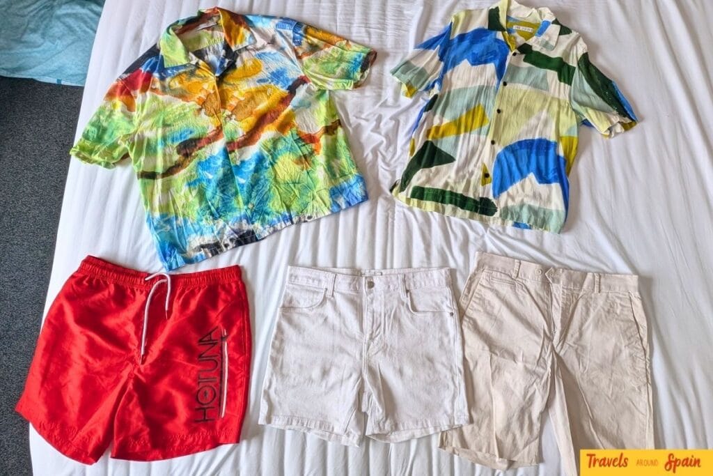 Lightweight summer clothing laid out for a trip to Spain.