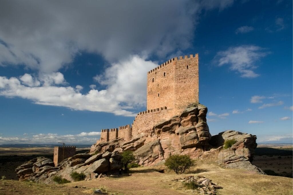 Castle of Zafra perched on a rocky ridge in Castilla-La Mancha, Spain, used as the Tower of Joy in Game of Thrones.