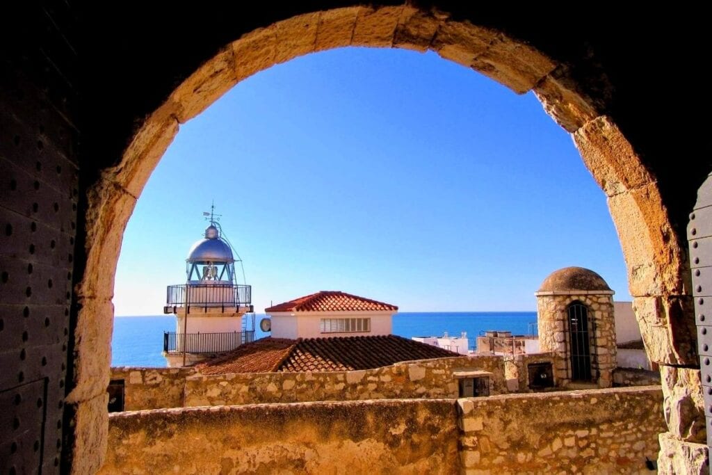 View through a stone archway in Peñíscola, Spain, which was used as the city of Meereen in Game of Thrones.