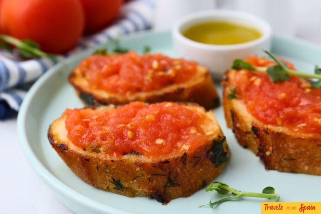 Traditional Catalan pa amb tomàquet served with olive oil