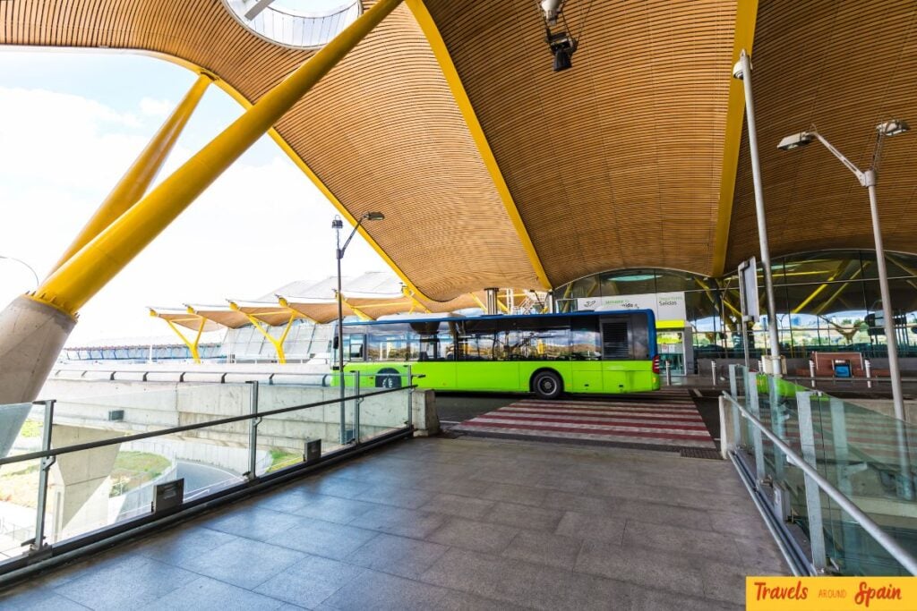 Airport shuttle bus outside Terminal 4 at Madrid-Barajas Airport.