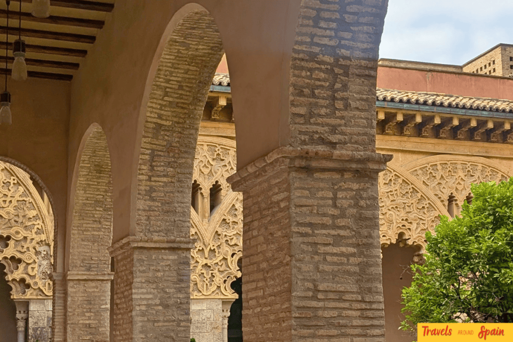 Decorative Moorish arches inside the Aljafería Palace in Zaragoza